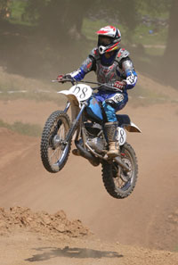 Bruce racing on a dirt bike